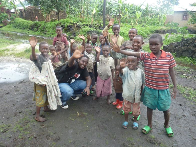 Omy K with Rwandan children